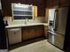 Traditional kitchen design, showcasing updated stainless steel appliances and wood cabinetry at 5535 Beaver Sw Dr, Mableton, GA 30126