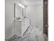 Modern bathroom features marble countertops and floors with a double sink vanity at 2117 Keheley Dr, Decatur, GA 30032