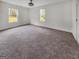 Bright bedroom with two windows and neutral carpet, perfect for a cozy retreat at 2117 Keheley Dr, Decatur, GA 30032