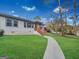Beautifully landscaped front yard with a winding walkway leading to the charming front porch at 2117 Keheley Dr, Decatur, GA 30032