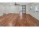 Spacious living room features beautiful hardwood floors, light walls, and a sliding barn door at 2117 Keheley Dr, Decatur, GA 30032