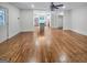 Open-concept living space with beautiful hardwood floors leading into the modern kitchen at 2117 Keheley Dr, Decatur, GA 30032