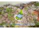 Bird's-eye view of property with a long circular driveway, bordered by water and wooded landscape at 160 Allie Dr, Mcdonough, GA 30252