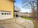 A yellow house with an upper deck above a two car garage with lake view at 160 Allie Dr, Mcdonough, GA 30252