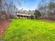 A well manicured lawn leading up to a large yellow house with multiple decks at 160 Allie Dr, Mcdonough, GA 30252