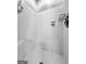 The walk-in shower features white tiling, a built-in seat, and a chrome organizer at 160 Allie Dr, Mcdonough, GA 30252