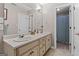 Bathroom featuring double sinks, wood cabinets, and a separate shower and bathtub at 160 Allie Dr, Mcdonough, GA 30252