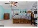 Unique bedroom featuring blue walls, wood furniture, and rustic decorations at 160 Allie Dr, Mcdonough, GA 30252