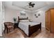 Bedroom features wood floors, tray ceiling, and a ceiling fan at 160 Allie Dr, Mcdonough, GA 30252