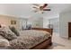 Spacious bedroom with neutral carpet, wood furniture, and a view of the backyard at 160 Allie Dr, Mcdonough, GA 30252