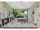 Eat-in kitchen/dining area showcasing vaulted ceilings, large windows, and granite countertop island with stovetop at 160 Allie Dr, Mcdonough, GA 30252