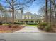 Inviting home with manicured landscaping and mature trees for added curb appeal at 160 Allie Dr, Mcdonough, GA 30252