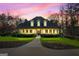 Charming exterior home view with a lush green lawn, shrubbery, and an inviting front walkway at 160 Allie Dr, Mcdonough, GA 30252