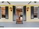 Inviting front entrance with black shutters, vintage lighting, and a glimpse of the staircase at 160 Allie Dr, Mcdonough, GA 30252
