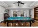 Basement game room with pool table, bar, and elegant columns at 160 Allie Dr, Mcdonough, GA 30252