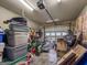 A cluttered garage filled with storage bins, tools, boxes, and household items at 160 Allie Dr, Mcdonough, GA 30252