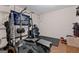 Home gym with weightlifting equipment, mats, and Georgia Southern University decor at 160 Allie Dr, Mcdonough, GA 30252