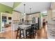 Bright eat-in kitchen features granite countertops, stainless steel appliances, and hardwood floors at 160 Allie Dr, Mcdonough, GA 30252