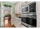 Kitchen view showcasing updated appliances, cabinetry, and granite counters at 160 Allie Dr, Mcdonough, GA 30252