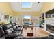 Bright living room with a fireplace, built-in bookshelves and access to the deck at 160 Allie Dr, Mcdonough, GA 30252