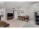 A bright living room with neutral walls, a beige carpet, and a warm, inviting atmosphere at 160 Allie Dr, Mcdonough, GA 30252