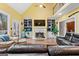 Open living room with a fireplace, built-in bookshelves and hardwood floors at 160 Allie Dr, Mcdonough, GA 30252