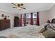 Inviting bedroom boasting a ceiling fan, an exterior balcony, and plush carpet at 160 Allie Dr, Mcdonough, GA 30252