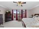 Bright main bedroom with large windows, a ceiling fan, and views of the outdoor deck at 160 Allie Dr, Mcdonough, GA 30252