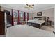 Spacious main bedroom with a scenic view, a ceiling fan, and carpet flooring at 160 Allie Dr, Mcdonough, GA 30252