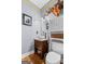 Charming powder room featuring a stylish vanity, round mirror, and decorative accents at 160 Allie Dr, Mcdonough, GA 30252