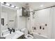 Bright bathroom with modern vanity, tub, and shower featuring neutral design elements at 1760 Campbell Ives Dr, Lawrenceville, GA 30045