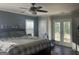 Bright main bedroom featuring outdoor access, neutral paint and large, sunny windows at 540 Dalrymple Rd, Sandy Springs, GA 30328