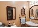 Charming bathroom with decorative mirrors, sink, and decorative accents at 630 Stoney Point Rd, Bowdon, GA 30108