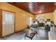 Bedroom featuring two beds, seating and a red metal ceiling at 630 Stoney Point Rd, Bowdon, GA 30108