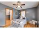 Comfortable bedroom with a full-sized bed, warm paint, and a ceiling fan at 630 Stoney Point Rd, Bowdon, GA 30108