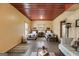 Bedroom featuring two beds, seating and a red metal ceiling at 630 Stoney Point Rd, Bowdon, GA 30108
