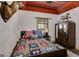 Bedroom featuring a bed, a wardrobe and a mounted deer head at 630 Stoney Point Rd, Bowdon, GA 30108
