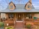 Charming home featuring a spacious front porch, perfect for relaxing and enjoying the outdoors at 630 Stoney Point Rd, Bowdon, GA 30108