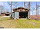 Rustic wood shed decorated with a metal star on a beautiful wooded lot at 630 Stoney Point Rd, Bowdon, GA 30108