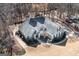 An aerial view of the charming one-story home with a well-manicured lawn and mature trees at 150 Valley Bluff Dr, Fayetteville, GA 30215