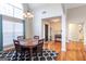 Bright dining room with a vaulted ceiling and a large arched window with a view of the front entrance at 150 Valley Bluff Dr, Fayetteville, GA 30215