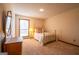 Bright bedroom featuring a vintage bed frame and a window providing ample natural light at 2191 Spear Point Dr, Marietta, GA 30062