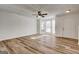 Spacious living room with wood-look floors, bay window, and lots of natural light at 3831 Waldrop Ln, Decatur, GA 30034