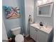 Bathroom with sink and toilet with a vanity and a mirror at 175 Monarch Dr, Peachtree City, GA 30269