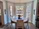 Breakfast nook featuring wood-look floors, a round table and natural light from bay windows at 175 Monarch Dr, Peachtree City, GA 30269