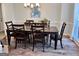 Charming dining room with wood-look floors and a wooden table with seating for six at 175 Monarch Dr, Peachtree City, GA 30269