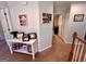 Hallway decorated with Gathering photos and wood trim at 175 Monarch Dr, Peachtree City, GA 30269