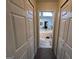 Hallway view into a Primary bathroom at 175 Monarch Dr, Peachtree City, GA 30269