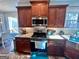 Well-lit kitchen with stainless steel appliances and granite countertops at 175 Monarch Dr, Peachtree City, GA 30269