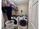 Laundry room with modern appliances and storage at 175 Monarch Dr, Peachtree City, GA 30269